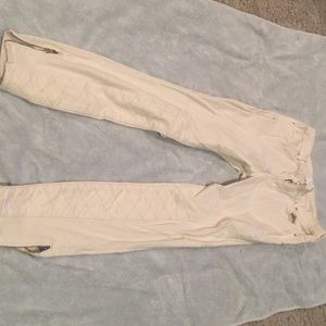 Beige pants with cute zips on the end of legs